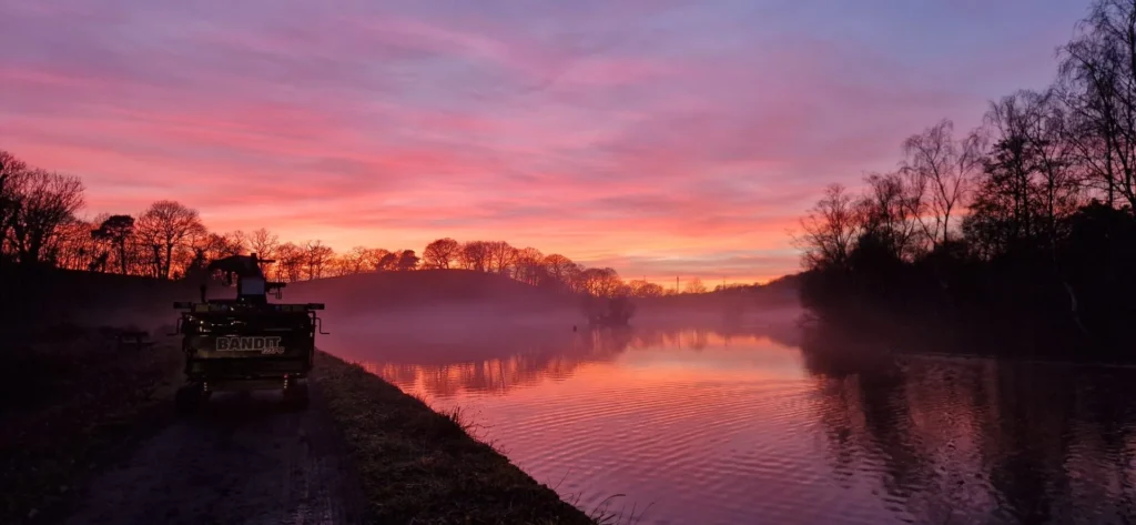 lake and woodland at sunset