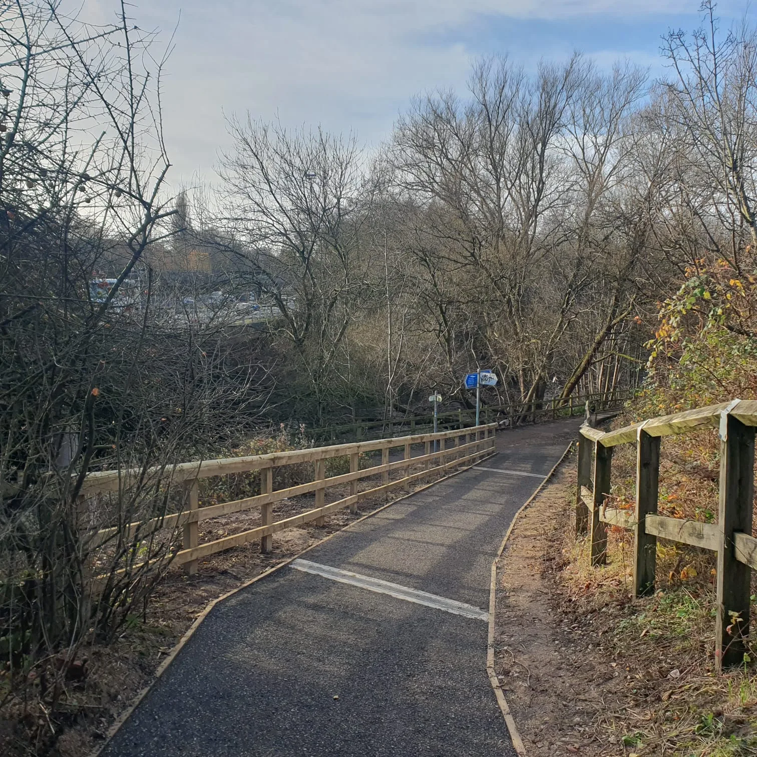 Resurfaced riverside walking path with new timber fencing and knee rails along the Mersey Valley